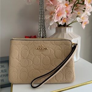 Coach Beige Wristlet with Gold Accents